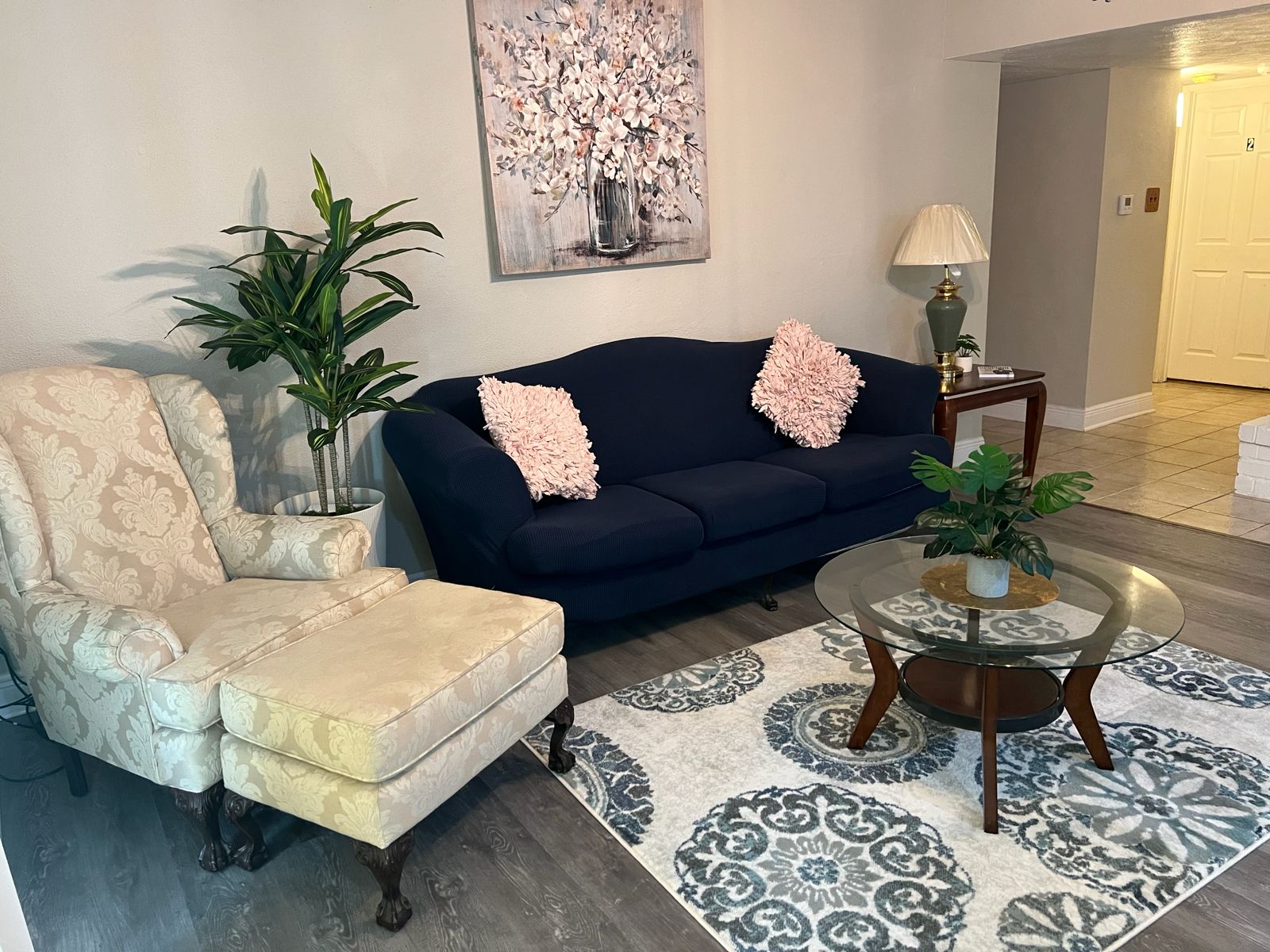 Cozy living room with navy sofa and accent chair