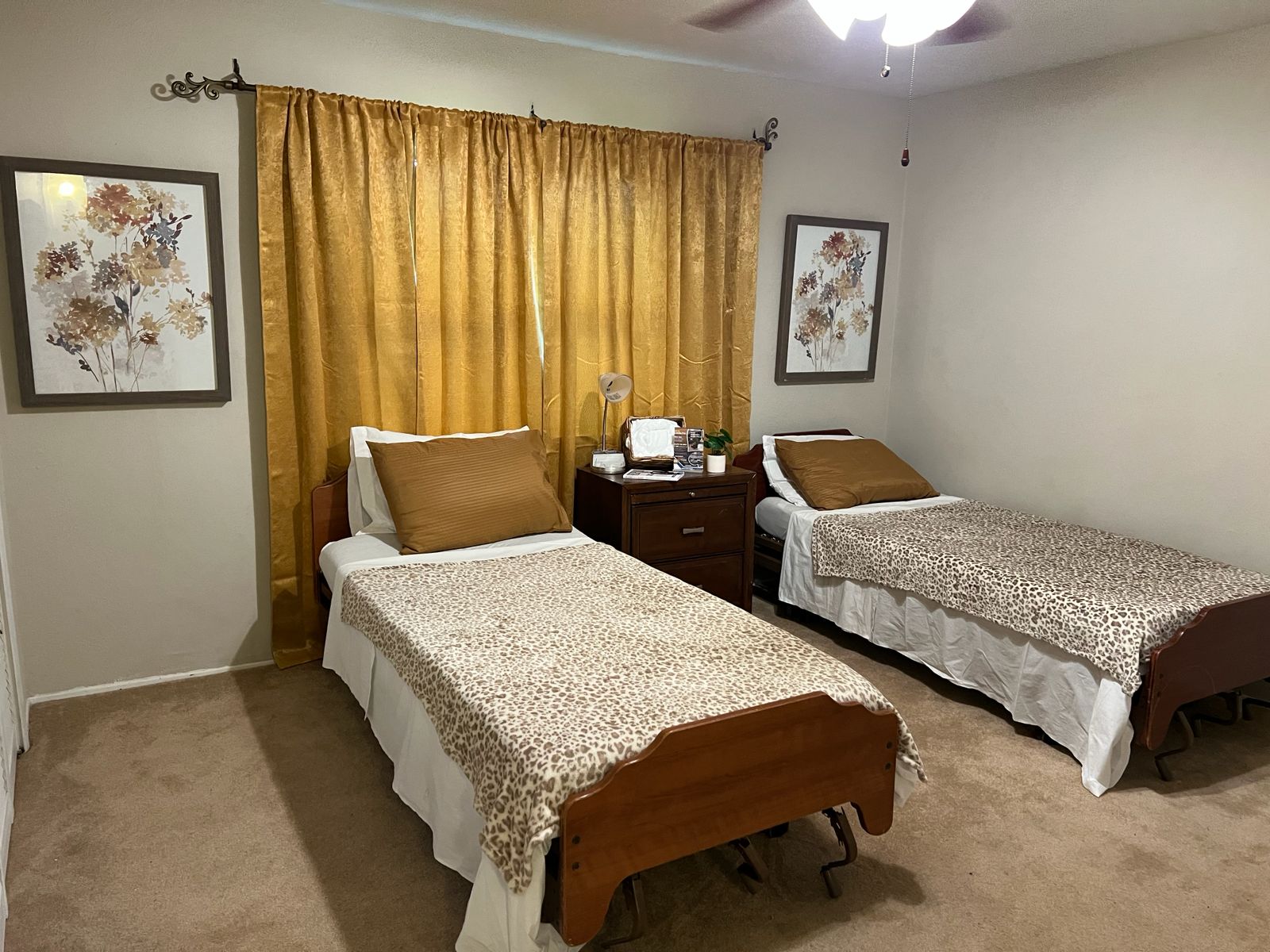 Comfortable bedroom with matching twin beds and warm curtains