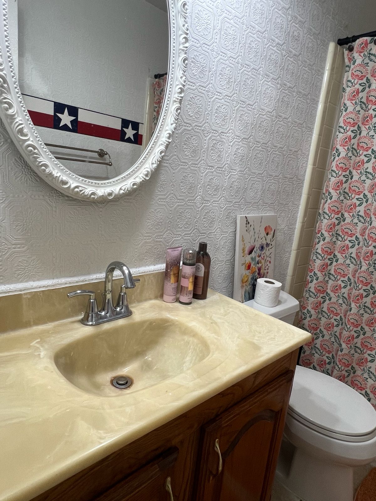 Bathroom vanity with mirror and toiletries